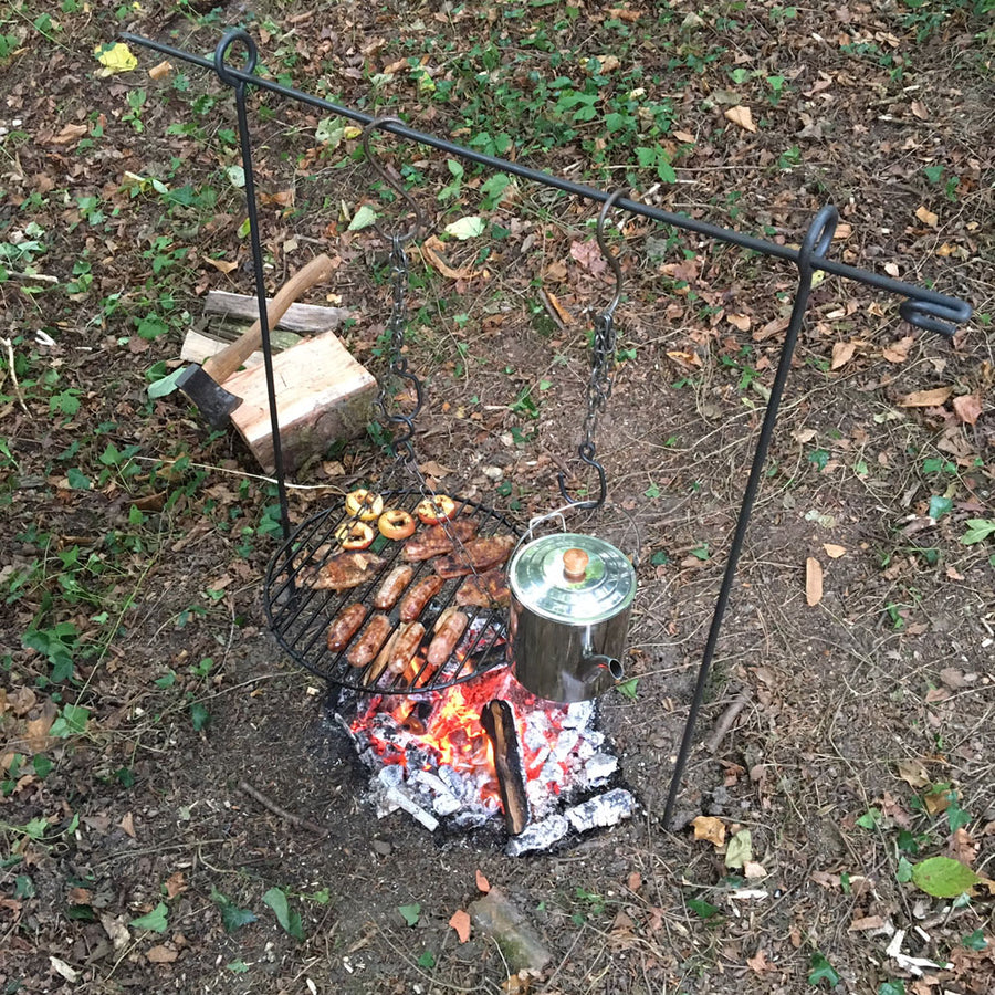 2in1 campfire cooking tripod being used as a hanging bar.